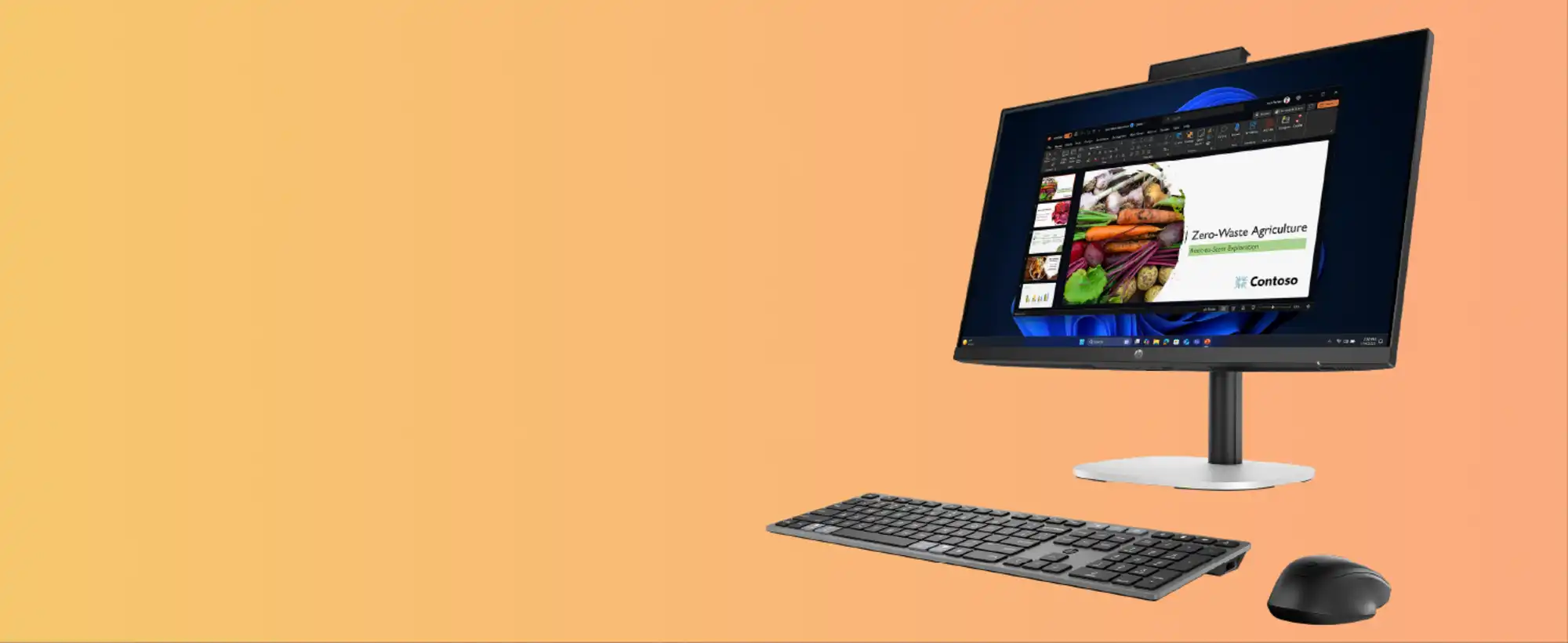 Komputer ProStudio 4 AiO G1i stojący na pomarańczowym tle po prawej stronie baneru